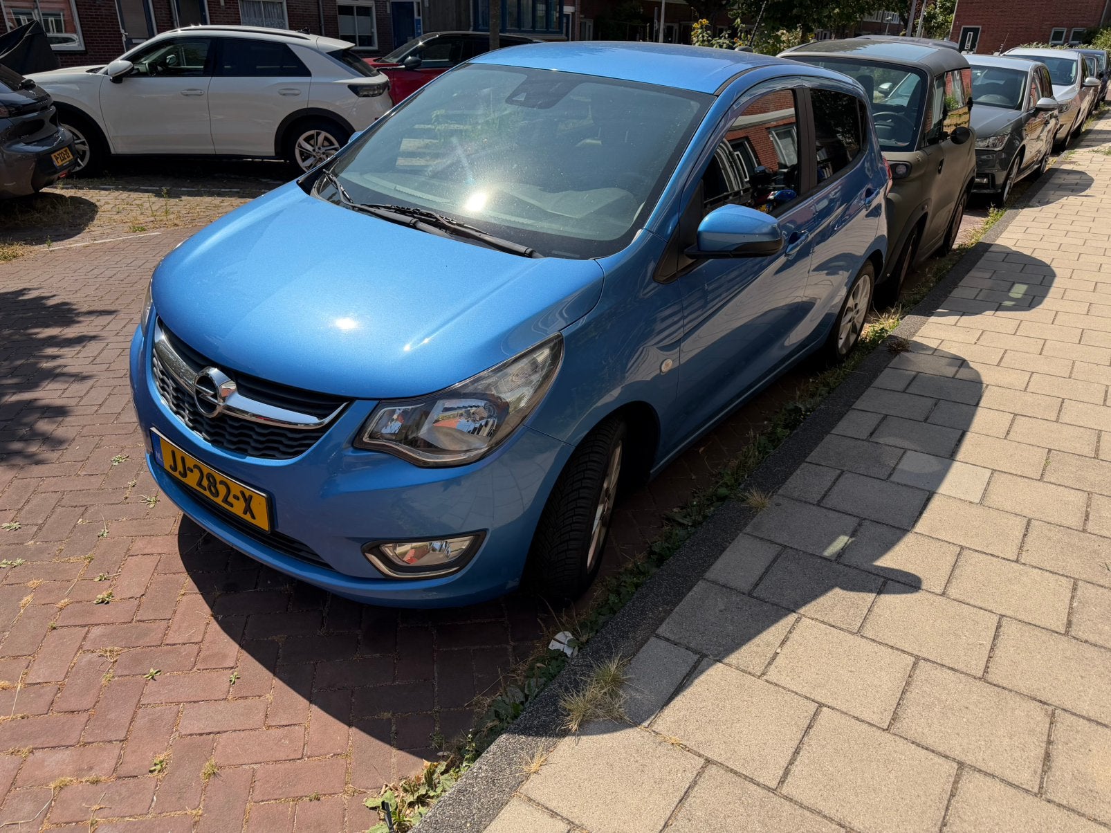 Opel Karl 1.0 Ecoflex 55KW 2016 Blauw, Auto's, Voorwielaandrijving, 839 kg, 74 pk, Zwart