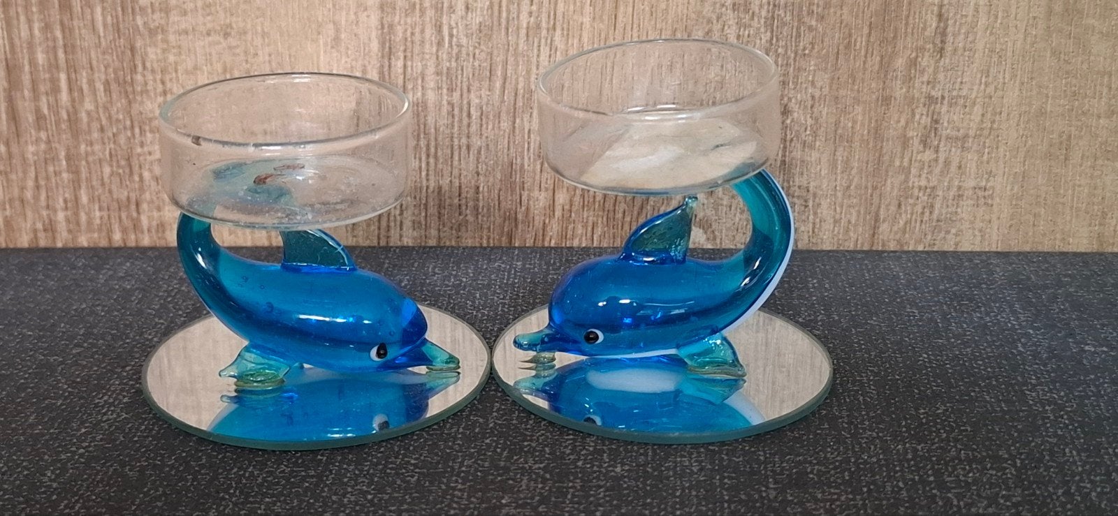 Dolfijnen glazen waxinelichthouders, Ophalen