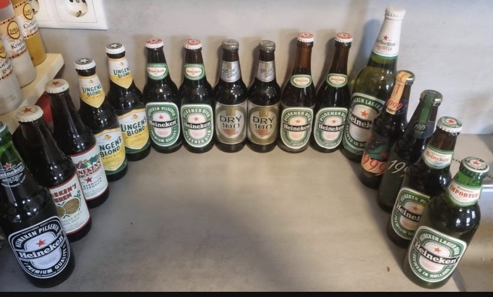 15x Heineken '86-02: Import, Zeefdruk, 50j, Lingen, Dry100 +, Ophalen of Verzenden, Zo goed als nieuw, Flesje(s), Heineken