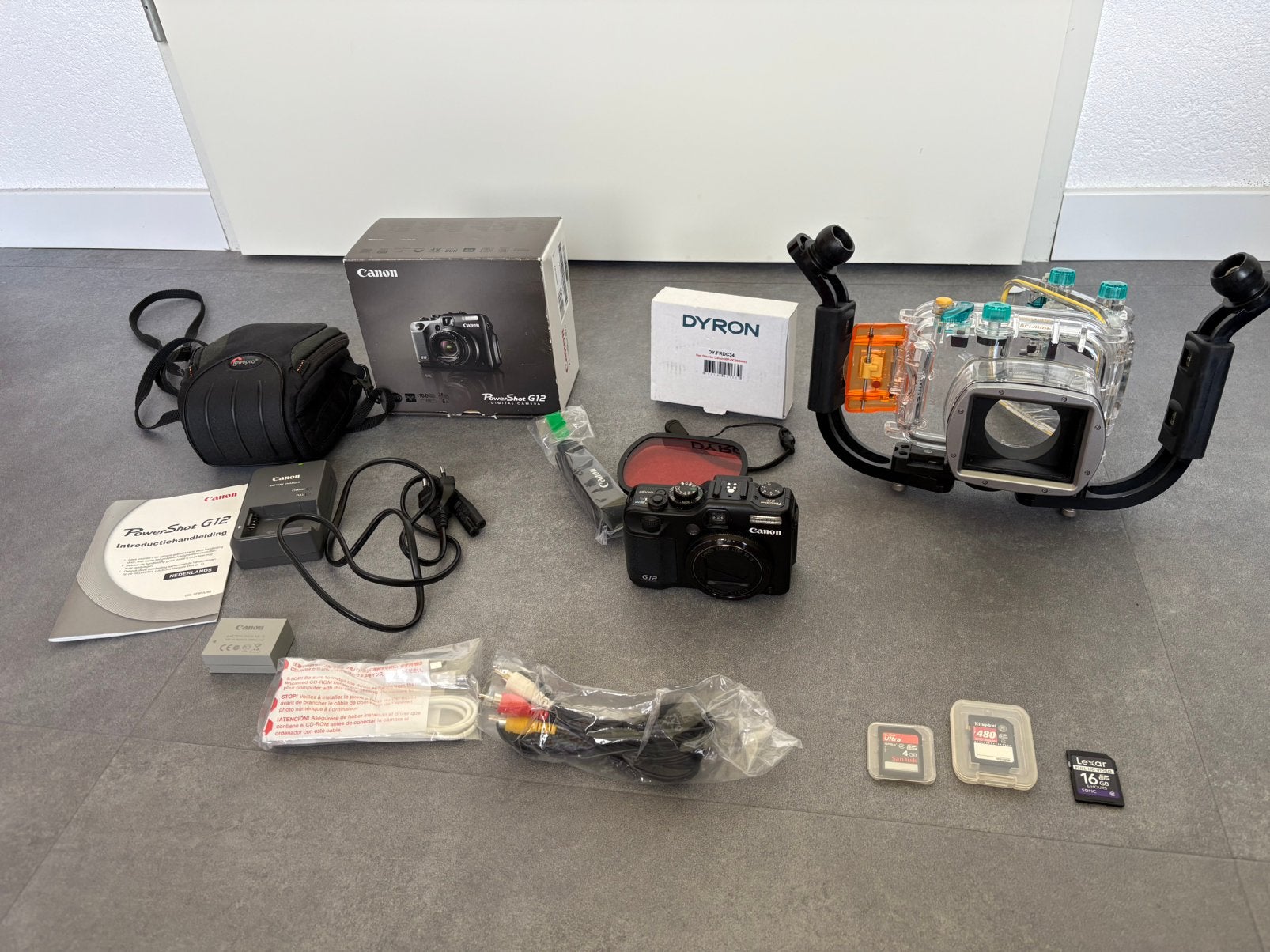 Canon Poweshot G12 in zeer goede staat met onderwaterhuis, Gebruikt, Canon, Ophalen of Verzenden, Compactcamera
