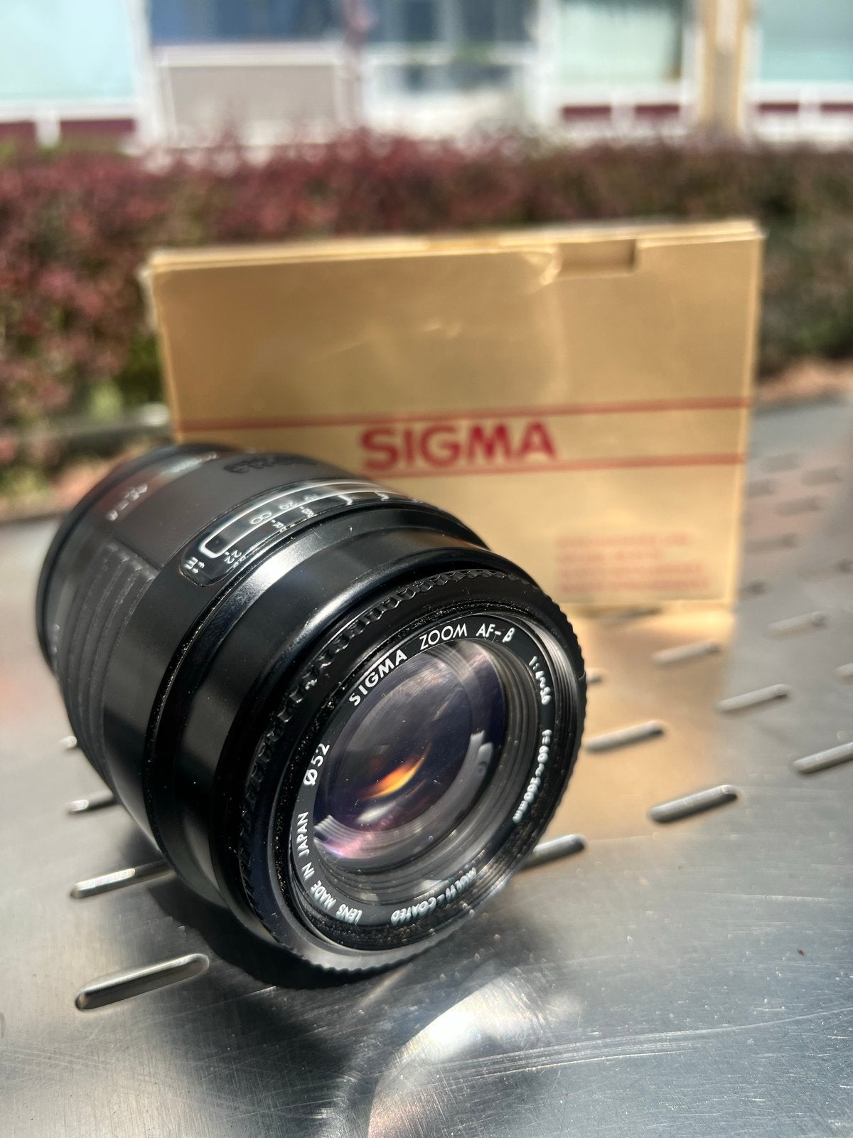 Sigma 60-200mm f/4-5.6 AF telezoomlens + 2 Hama 52mm filters, Audio, Tv en Foto, Fotografie | Lenzen en Objectieven, Gebruikt