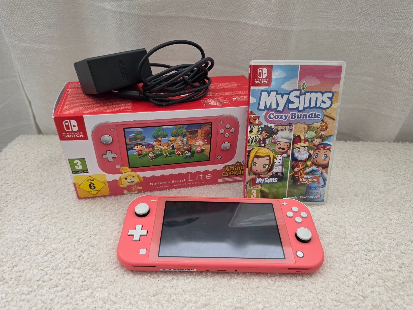 Nintendo Switch Lite Coral + games, Ophalen of Verzenden, Roze of Coral, Zo goed als nieuw