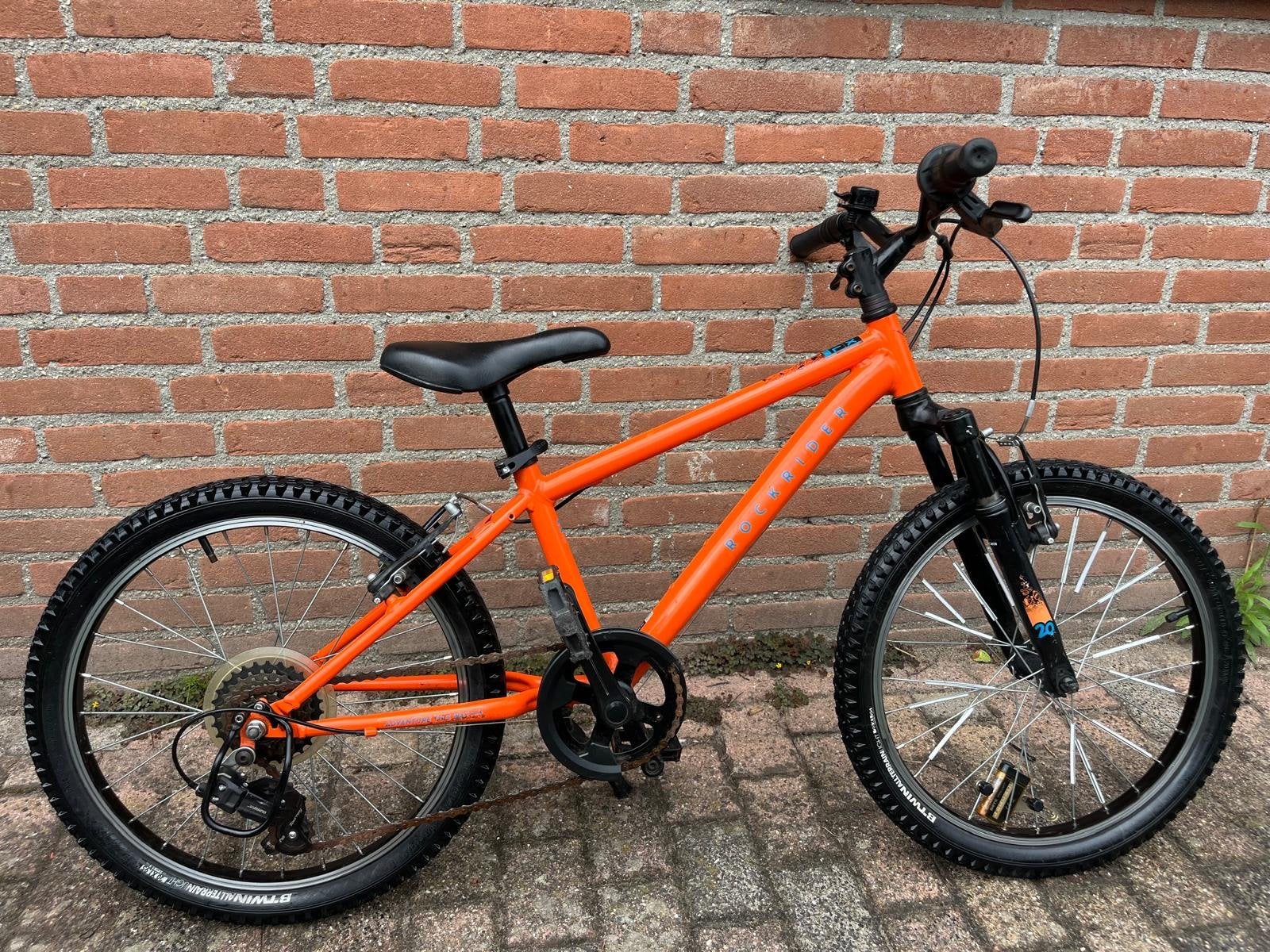 Oranje kinderfiets 20 inch - B'Twin Rockrider, Ophalen, Gebruikt, Velgrem, 20 inch of meer