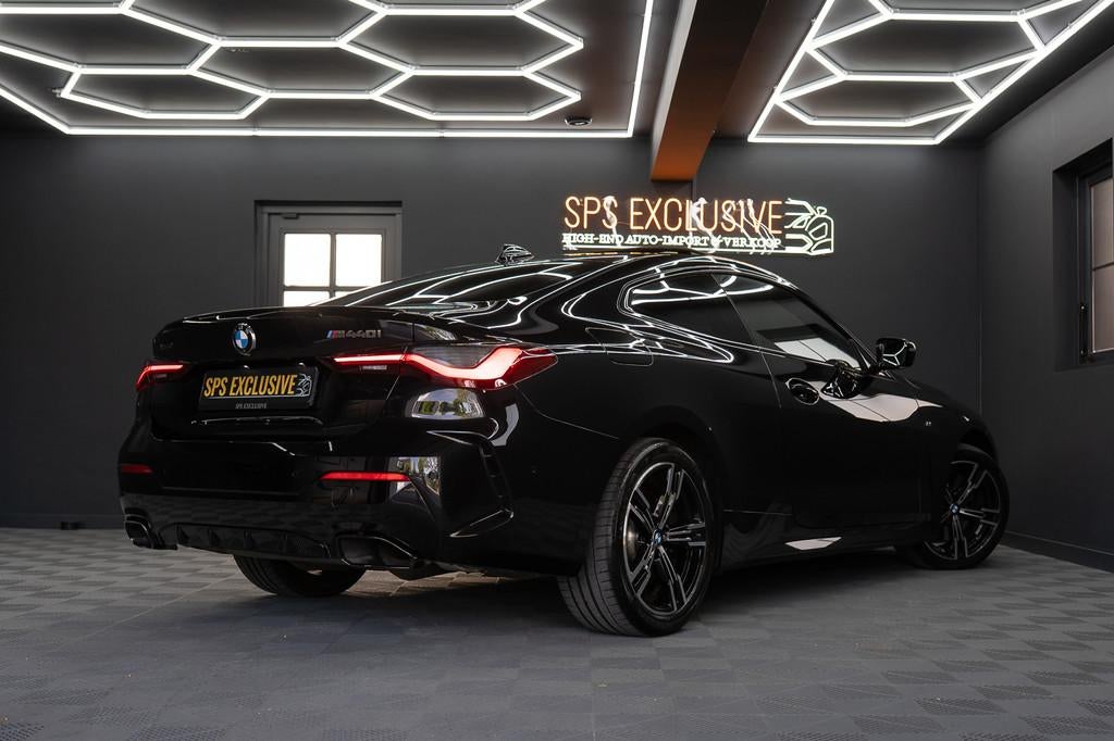 BMW 4 Serie Coupé M440i xDrive High Executive / Adaptive /, Auto's, BMW, Automaat, 4 stoelen, Zwart, Bedrijf