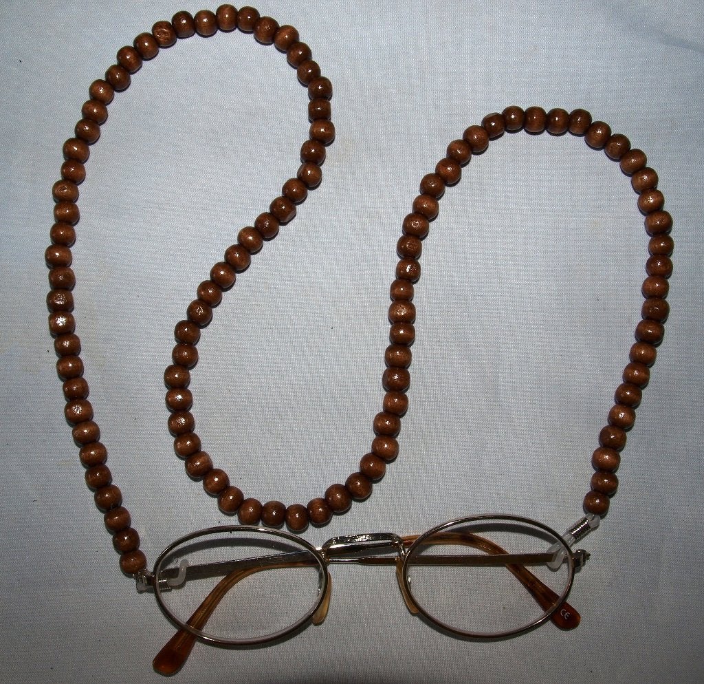 brilkoordje van bruine kralen 74 cm lang, Ophalen of Verzenden, Nieuw, Bruin, Overige materialen