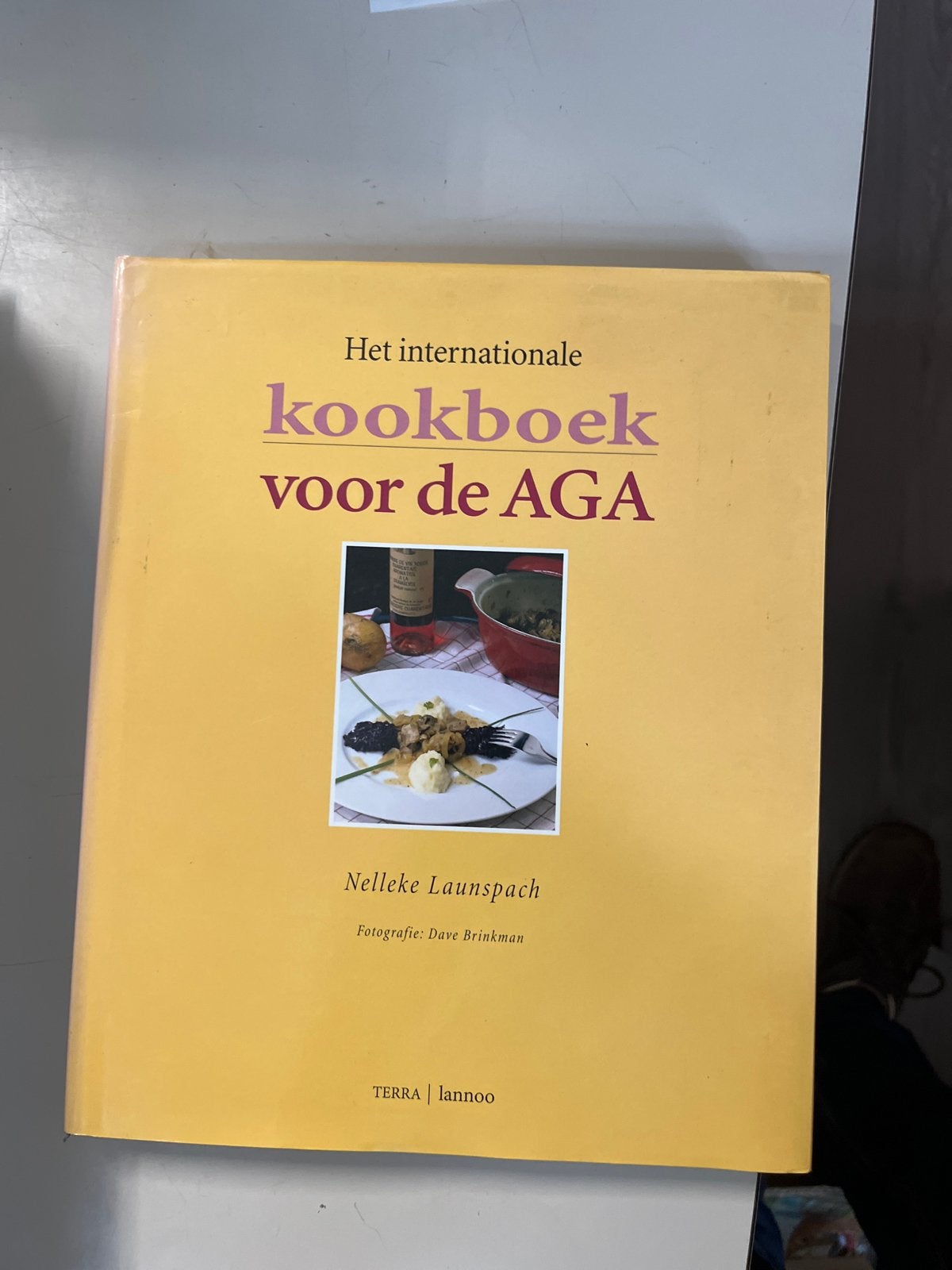 Het Internationale Kookboek voor de AGA - Nelleke Launspach, Ophalen of Verzenden, Zo goed als nieuw
