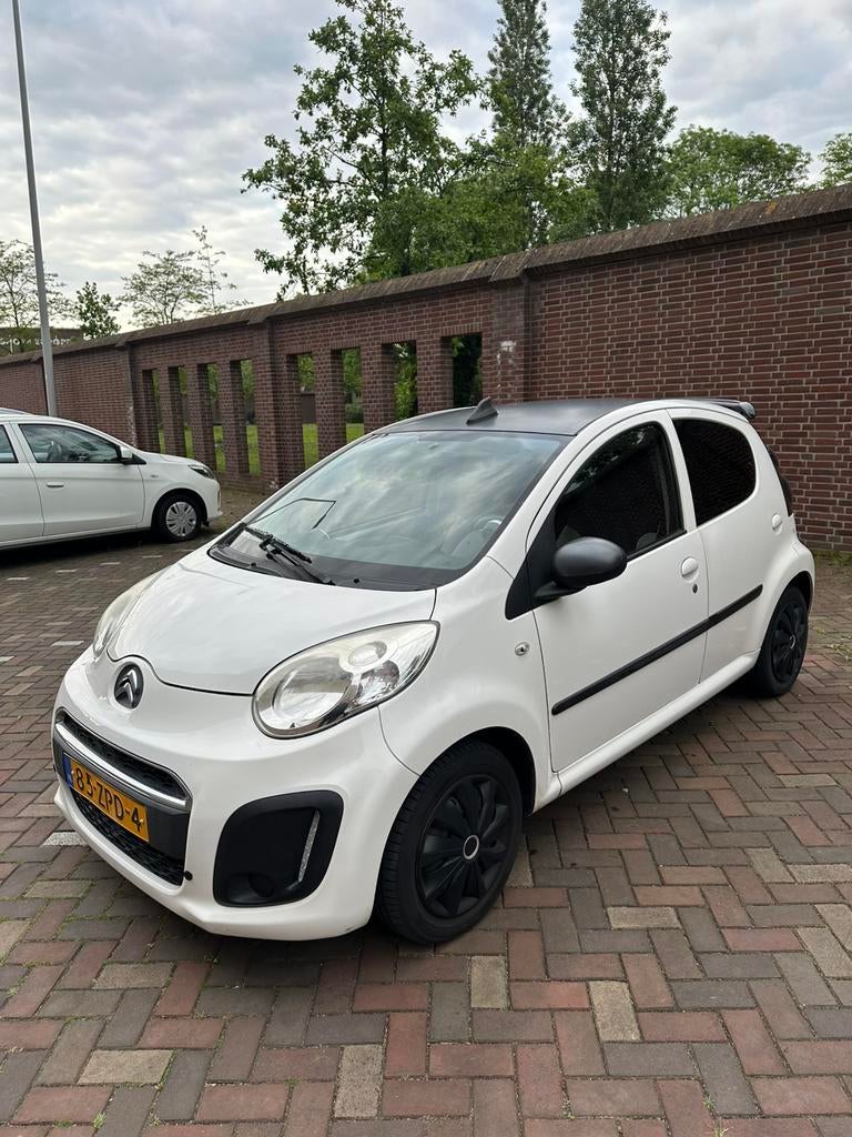 Citroën C1 2013 Lichte schade, met airco en bluetooth, Voorwielaandrijving, Euro 5, Stof, 4 stoelen