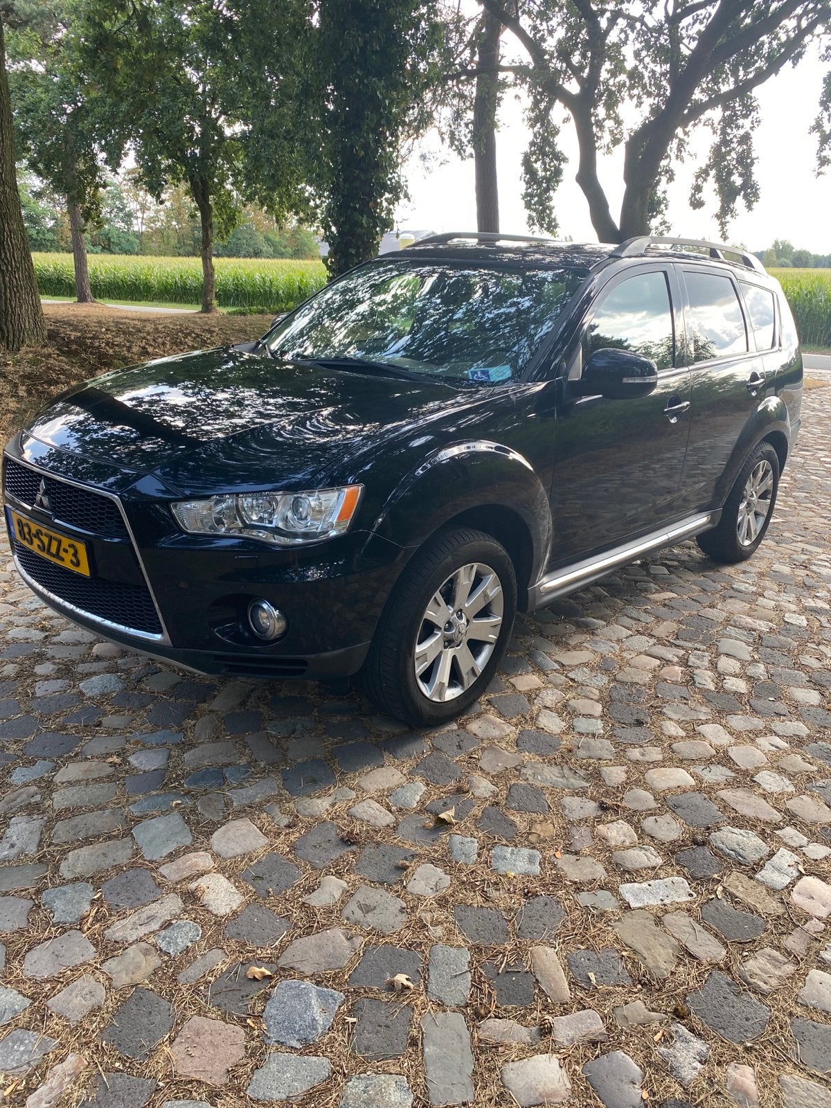 Mitsubishi Outlander 2.0 MPI 2WD CVT 2012 Zwart, Auto's, 1998 cc, Outlander, 4 cilinders, Zwart