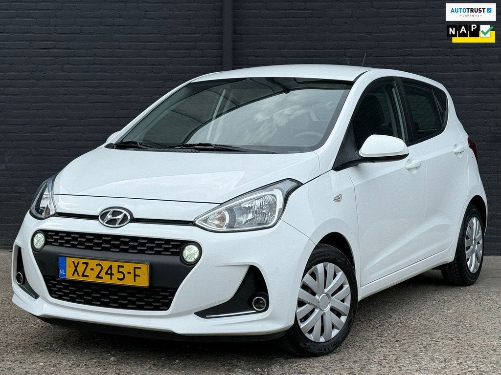 Hyundai I10 1.0i Comfort AIRCO | CRUISE | ELEK RAMEN | NWE A, Auto's, Stof, Gebruikt, 4 stoelen, Wit