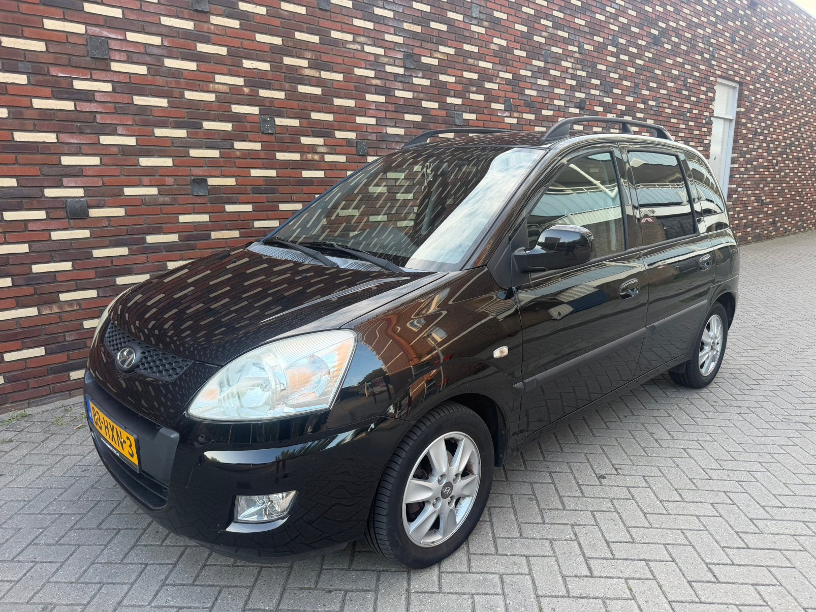 Hyundai Matrix 1.6 automaat 2009 Zwart APK 30-11-2026, Auto's, Matrix, 1599 cc, 4 cilinders, Zwart