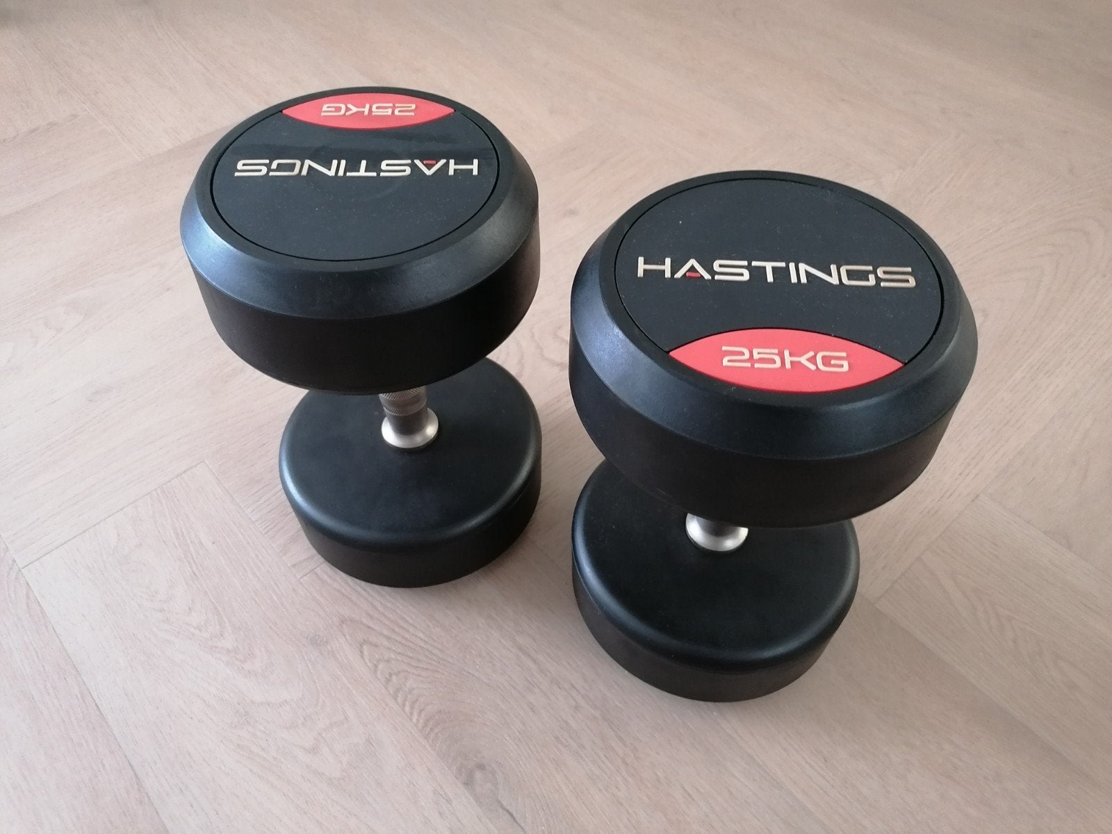 Hastings rubberen dumbbells set 2x 25kg professioneel, Ophalen, Zo goed als nieuw, Rug, Dumbbell