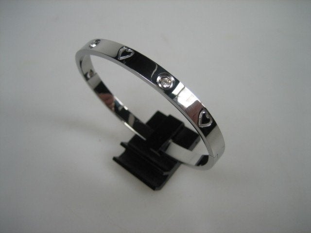 Moderne Italiaanse zilverkleurige slavenarmband, Sieraden, Tassen en Uiterlijk, Met kristal, Staal, Verzenden, Nieuw