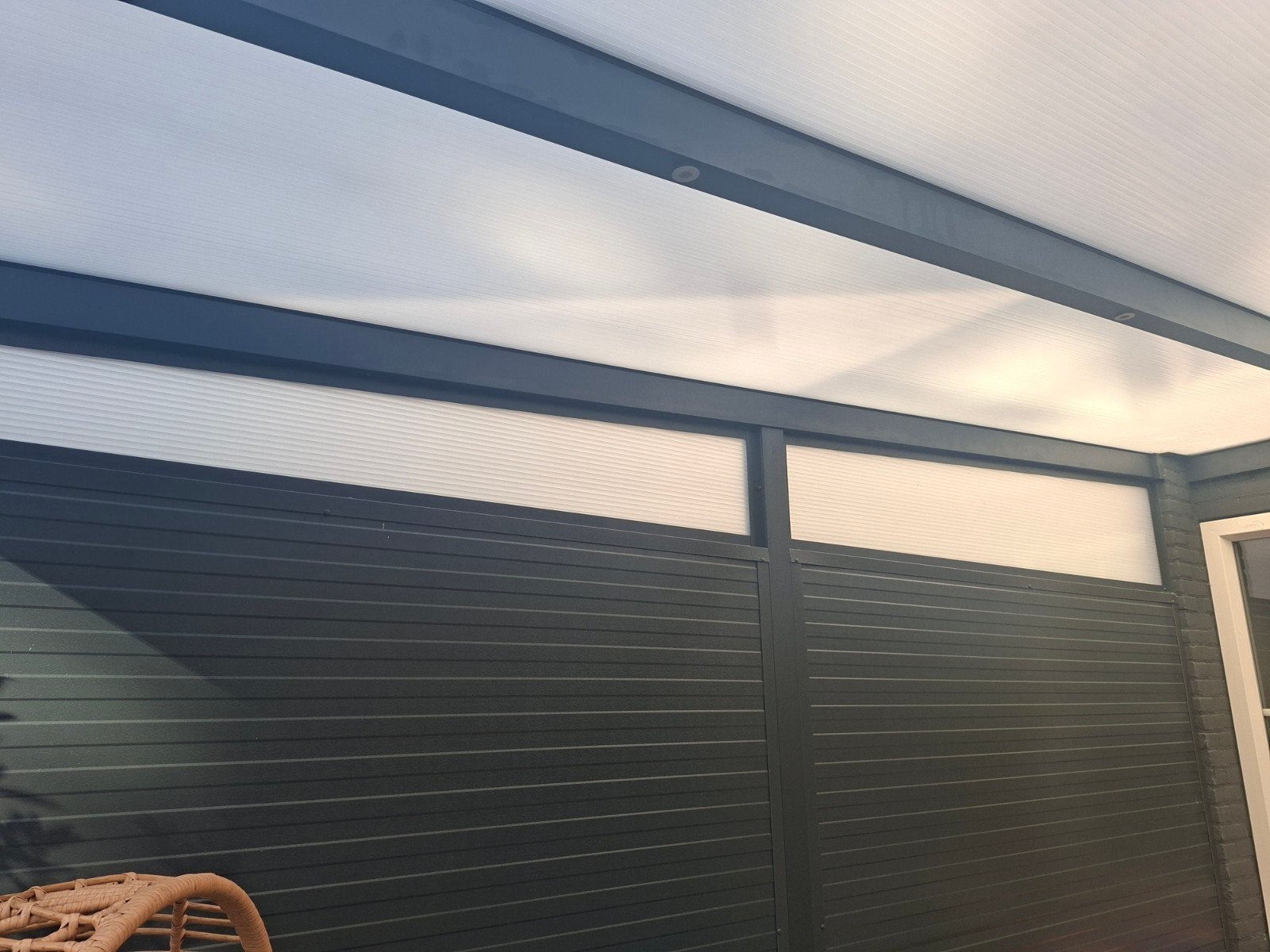 Foto 5 van Moderne Veranda/Tuinkamer met Glazen Schuifwanden