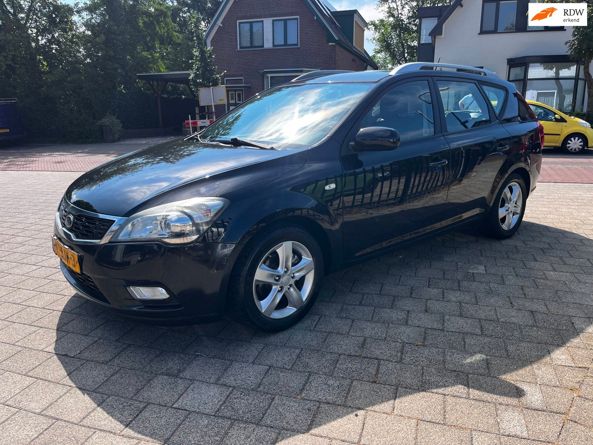 Kia Cee'd Sporty Wagon 1.4 CVVT Navigator Ecc Navi Isofix LM, Auto's, Voorwielaandrijving, Euro 5, Stof, Gebruikt
