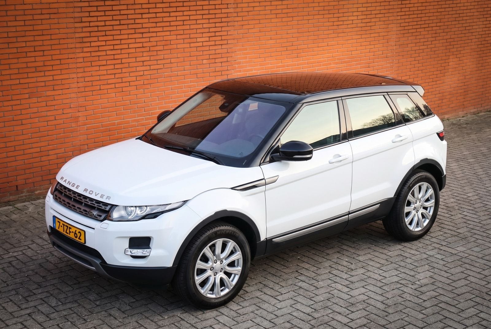 Range Rover Evoque 2.0 SI4 4WD AUT PANO, Auto's, Euro 5, 1800 kg, Zwart, 4 cilinders