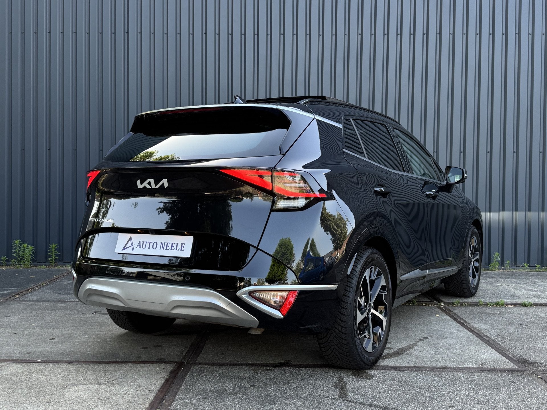 Kia Sportage 1.6 T-GDi 230 pk Hybrid Spirit PlusLine Panoram, Auto's, Kia, Adaptive Cruise Control, Gebruikt, Zwart, 4 cilinders