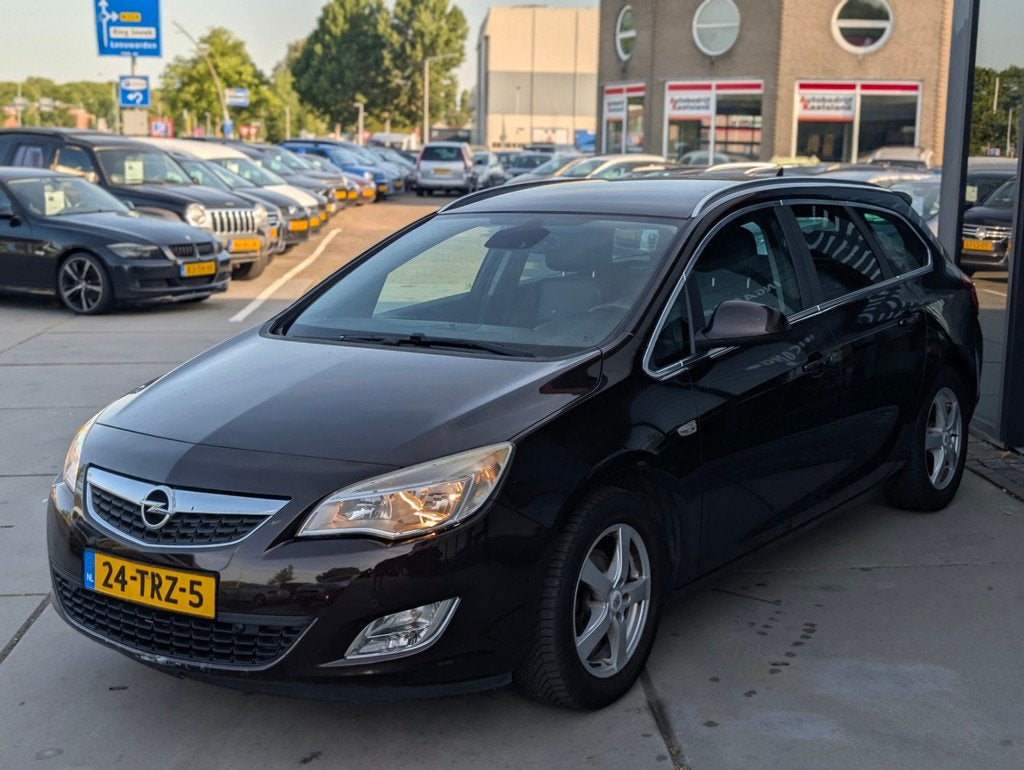 Opel Astra Sports Tourer 1.4 Turbo Cosmo LPG G3 - Leder - Tr, Auto's, Voorwielaandrijving, Euro 5, Stof, Gebruikt