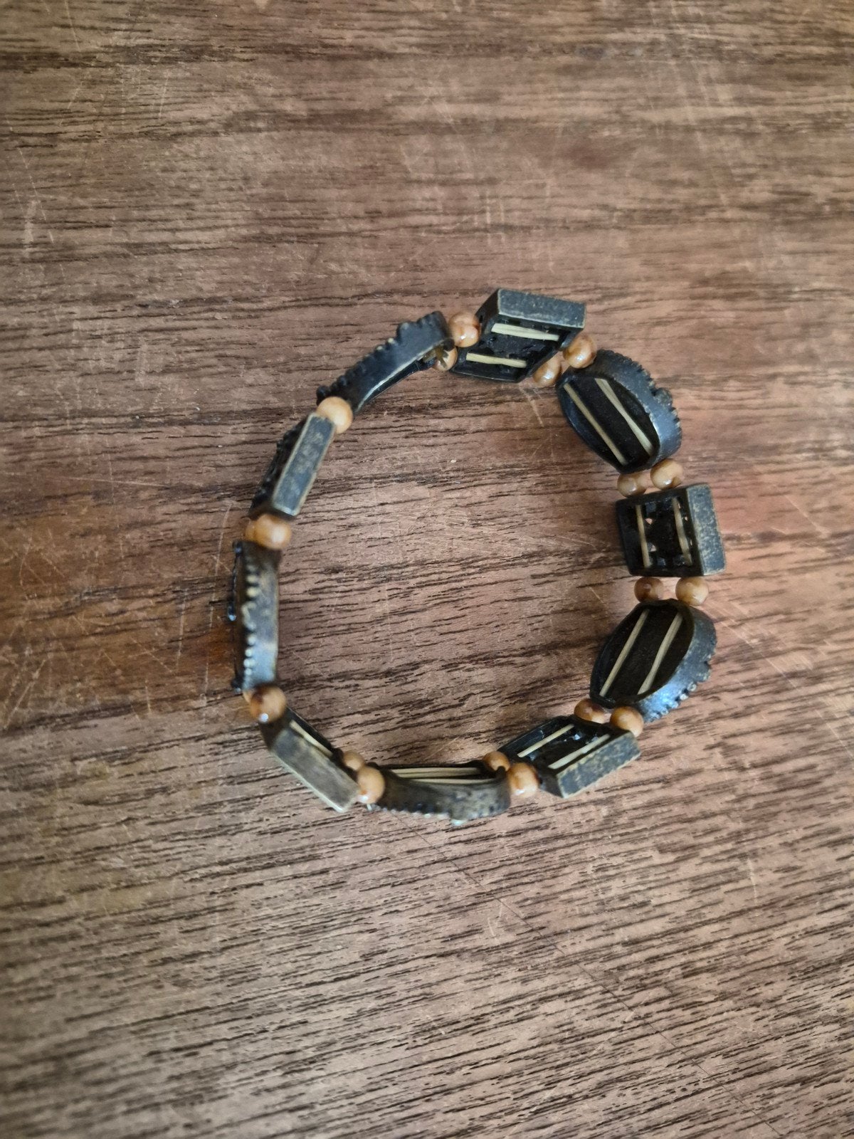 Unieke armband met ingelegde details, Bruin, Ophalen of Verzenden, Zo goed als nieuw, Met bedels of kralen