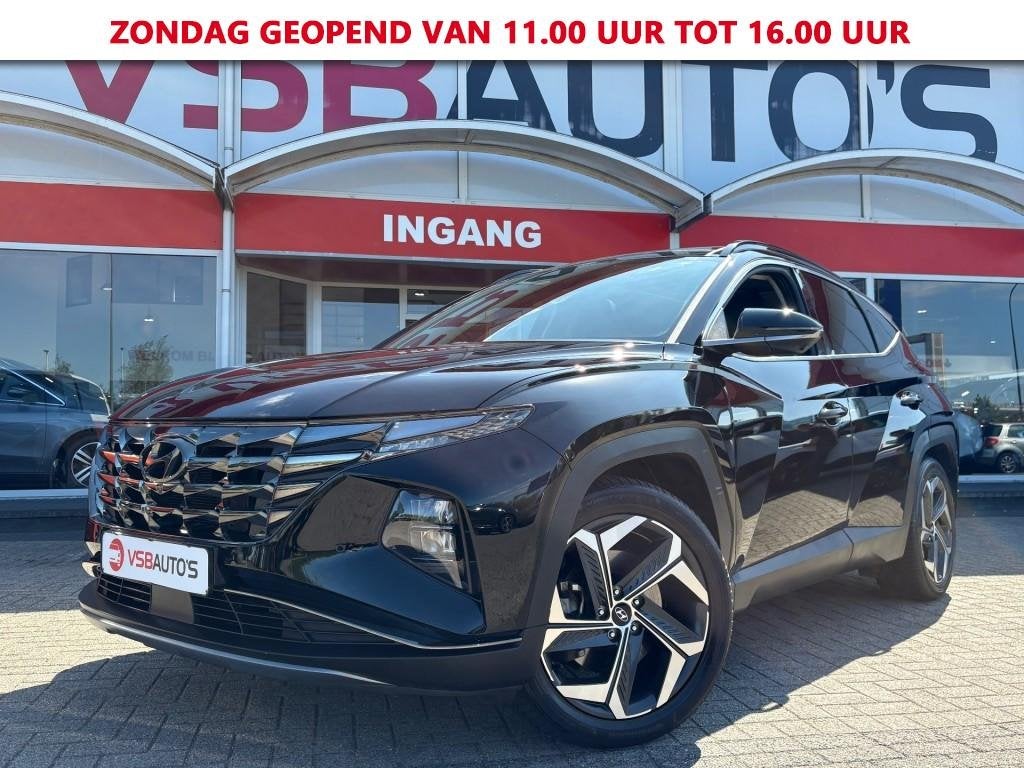 Hyundai TUCSON 1.6 T-GDI AUT. PHEV 4WD 265PK PANO-DAK LEER N, Auto's, Automaat, USB, Gebruikt, Huisgarantie