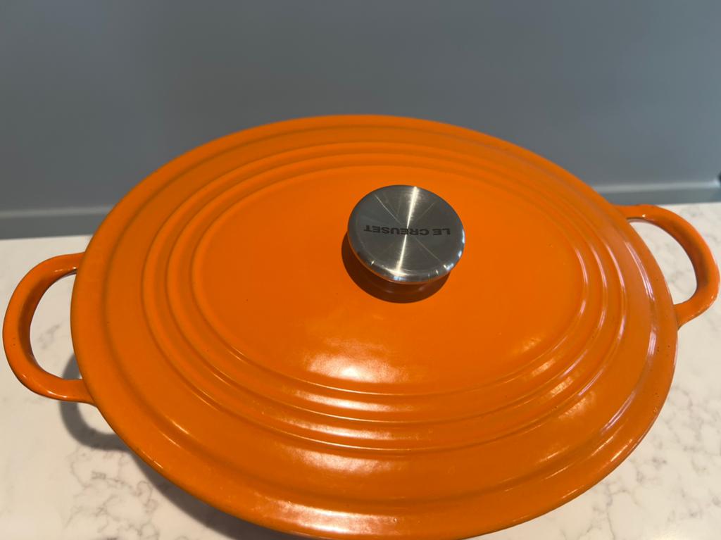 Vintage Le Creuset ovaal 27 cm, Harmonic Orange heel goed, Huis en Inrichting, Keuken | Potten en Pannen, Gebruikt, Gietijzer