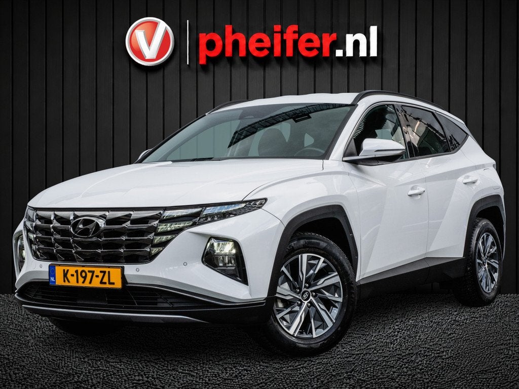 Hyundai Tucson 1.6 T-GDI 180pk Aut. HEV Comfort Trekhaak/ Ca, Auto's, Stof, Gebruikt, 4 cilinders, Met garantie (alle)