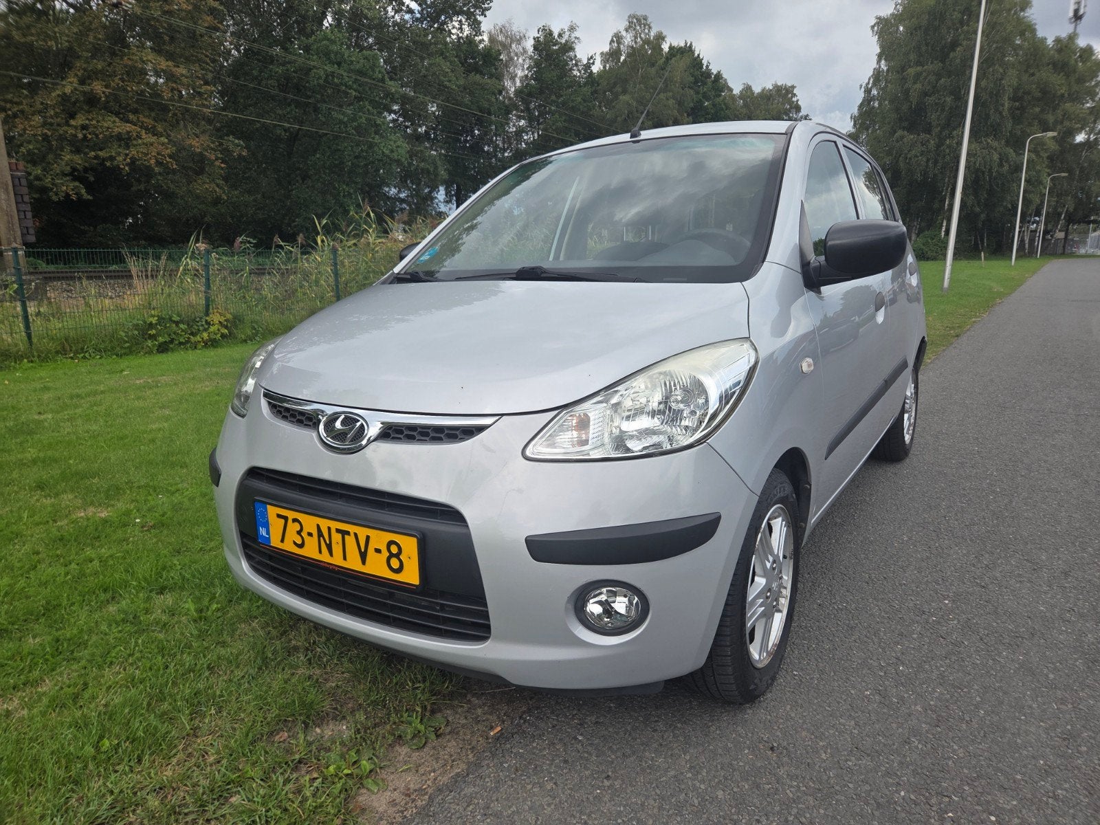 Hyundai i10 1.1I 5DR AUT 2010 Grijs, Auto's, Hyundai, Stof, 4 cilinders, Origineel Nederlands, Bedrijf