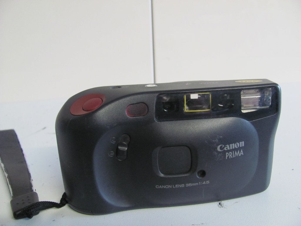 CANON PRIMA  4 35mm compact camera met goede werking, Audio, Tv en Foto, Fotocamera's Analoog, Ophalen of Verzenden, Zo goed als nieuw