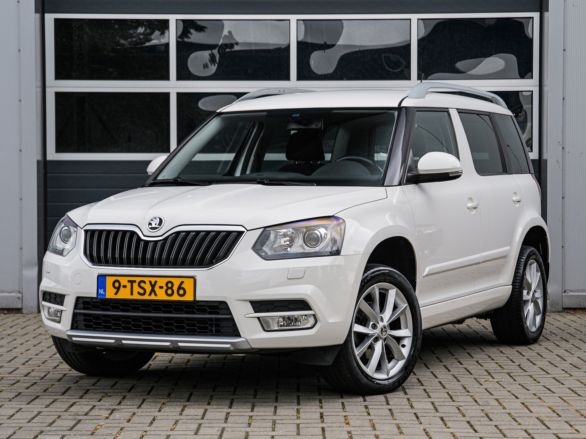 Skoda Yeti 1.4 TSI Elegance | Navi | Camera | Xenon | Trekha, Auto's, Skoda, Voorwielaandrijving, Euro 5, Stof, Gebruikt