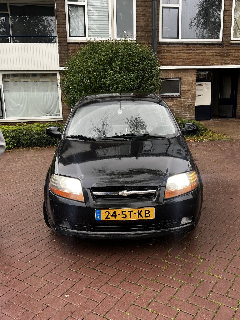 Chevrolet Kalos 1.4 16V 3D AUT 2006 Zwart, Auto's, 94 pk, Stof, 40 €/maand, Zwart
