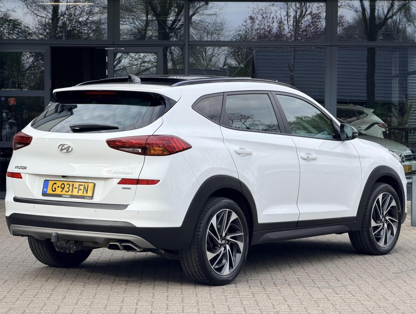 Hyundai Tucson 1.6 T-GDi Premium 4WD | Pano | Stoel-Stuurver, Auto's, Hyundai, Gebruikt, 4 cilinders, Lichtsensor, Wit