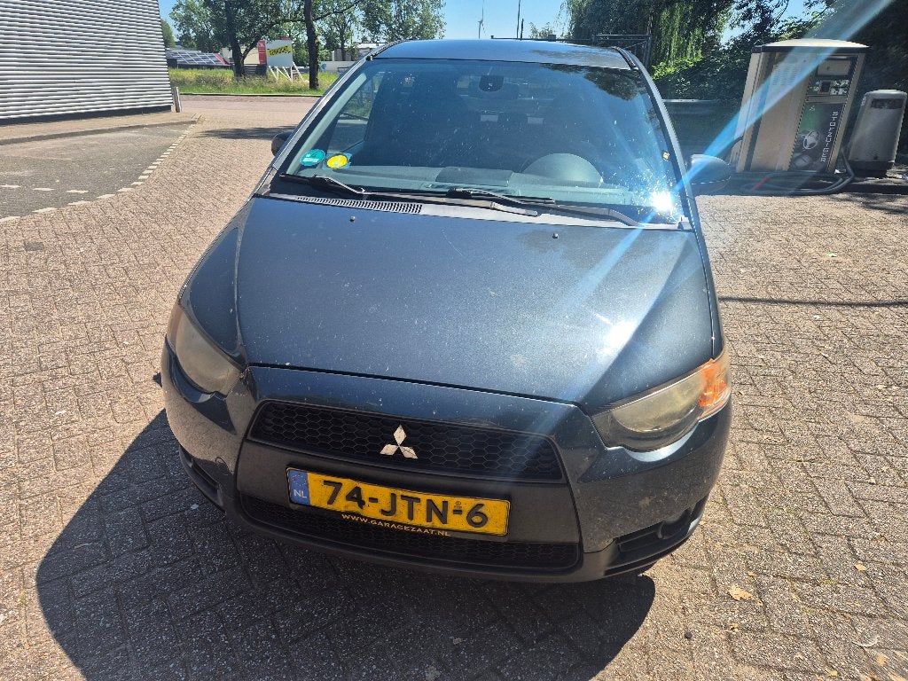 Mitsubishi Colt 1.3 cleartec 5-DR 2009 Grijs (met schade), Auto's, Mitsubishi, Particulier, Colt, ABS, Airconditioning, Bluetooth