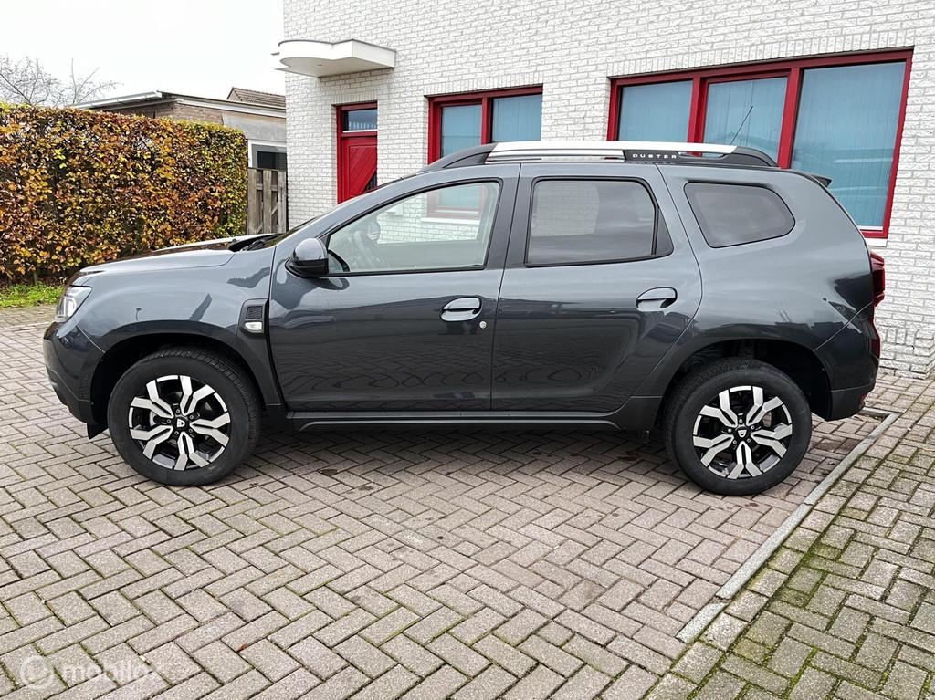 Dacia Duster 1.3 TCe AUTOMAAT/CAMERA/NAVI/CRUISE, Auto's, Dacia, Stof, Gebruikt, Zwart, 4 cilinders