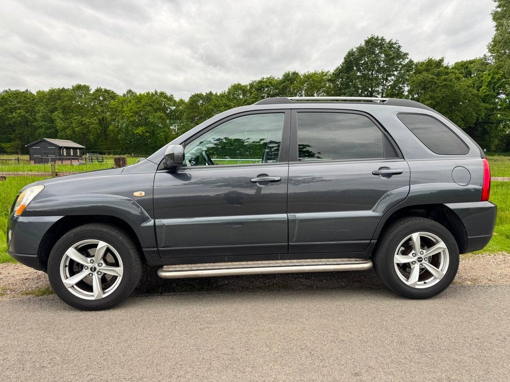 Kia Sportage 2.0 CVVT X-ecutive 4WD keurig onderhouden|navig, Auto's, Kia, Keurmerk '100% Onderhouden', Stof, Gebruikt, 4 cilinders