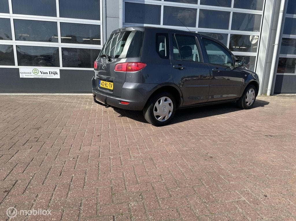Mazda 2 1.4 Touring met trekhaak en airco, Auto's, Mazda, Voorwielaandrijving, 40 €/maand, 4 cilinders, Elektrische ramen