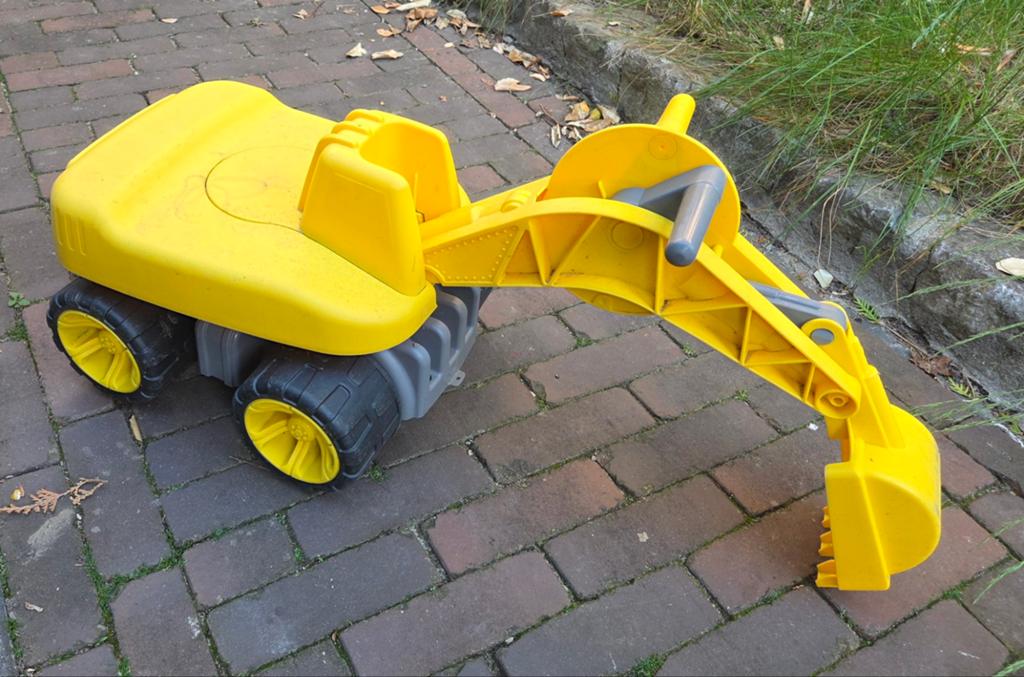 Gele speelgoed graafmachine voor kinderen, Ophalen