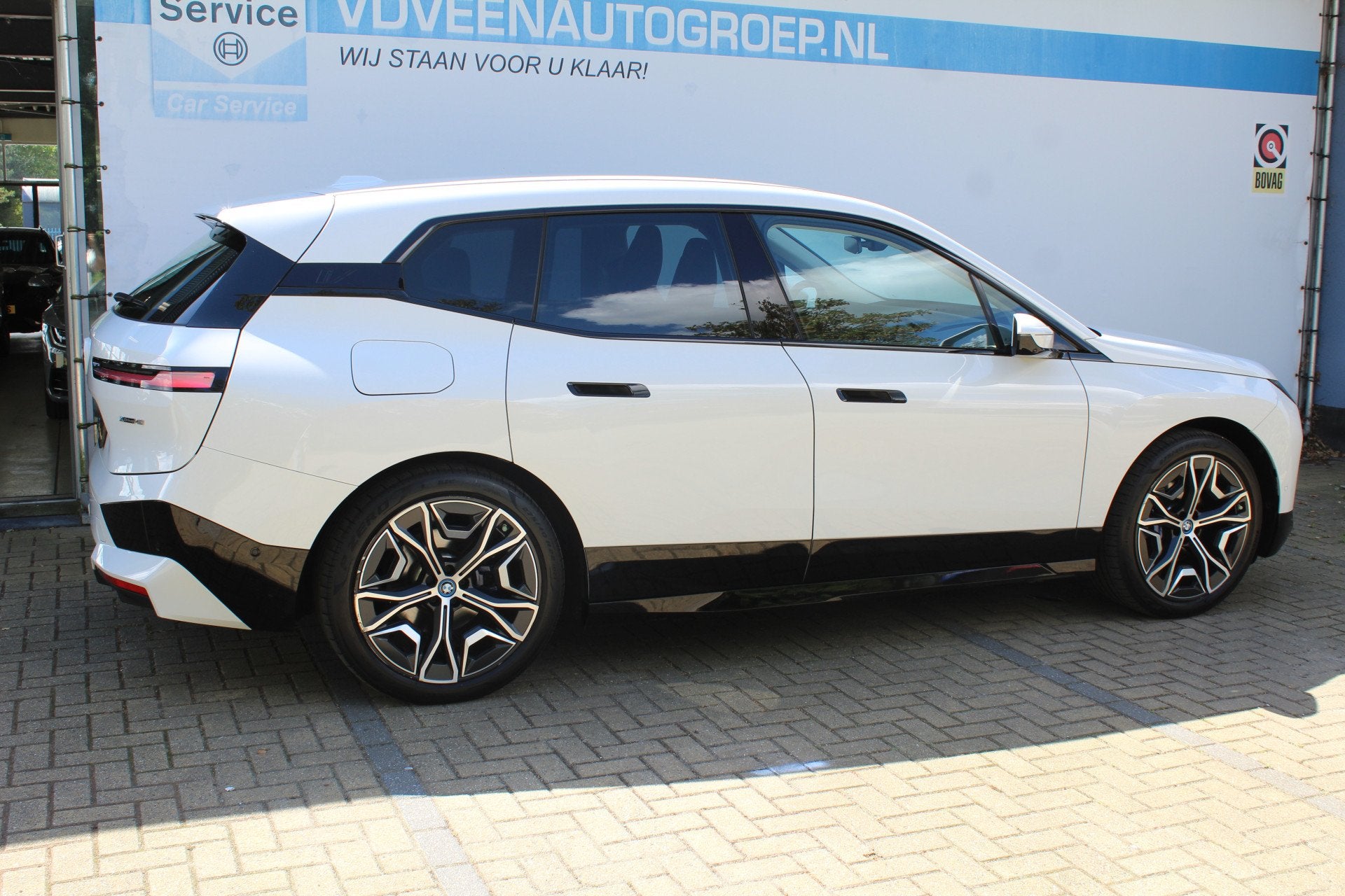 BMW iX xDrive40 Executive 77 kWh | SoH 100% | Incl. 12 maand, Automaat, Gebruikt, Met garantie (alle), Wit