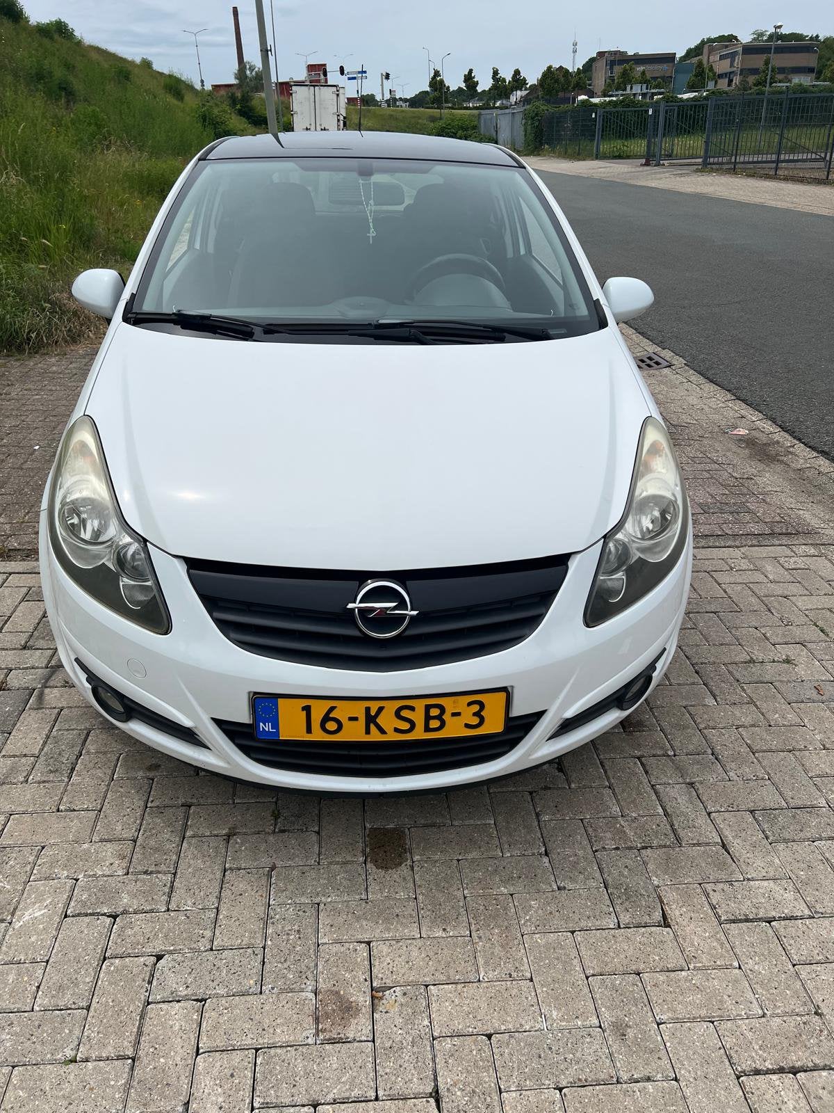 Opel Corsa 2010 Wit, Auto's, Stof, Zwart, Wit, Handgeschakeld