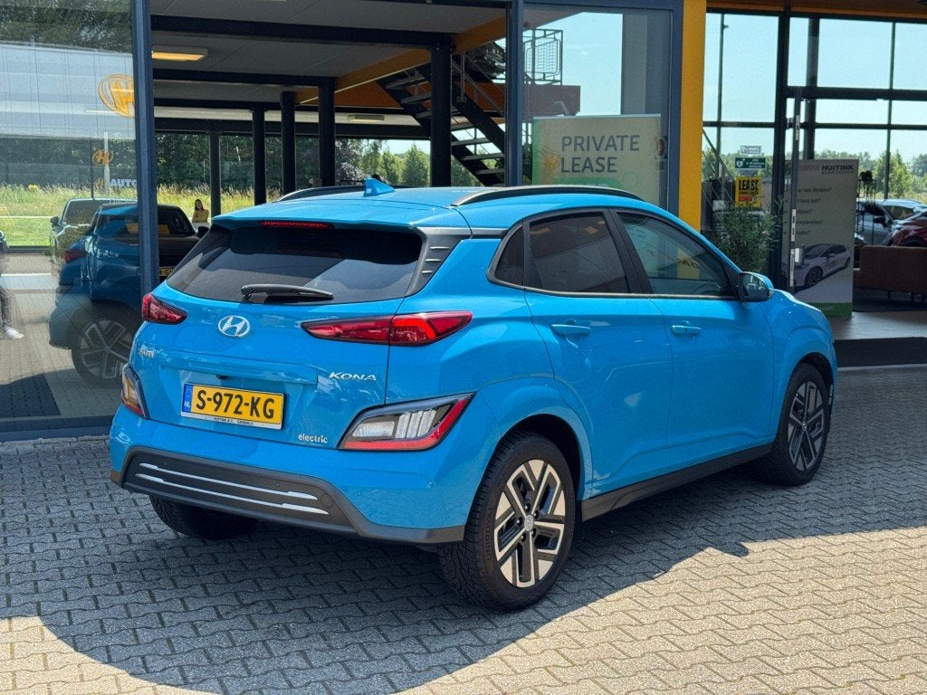 Hyundai Kona EV 64kWh Premium - Navi - camera - stoel/stuur, 12 maanden, 14 kWh, Gebruikt, Blauw