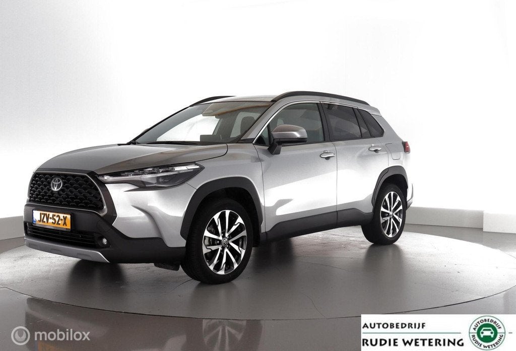 Toyota Corolla Cross Hybrid 140PK Dynamic led|nav|cam|dab|ac, Stof, Gebruikt, 4 cilinders, Met garantie (alle)