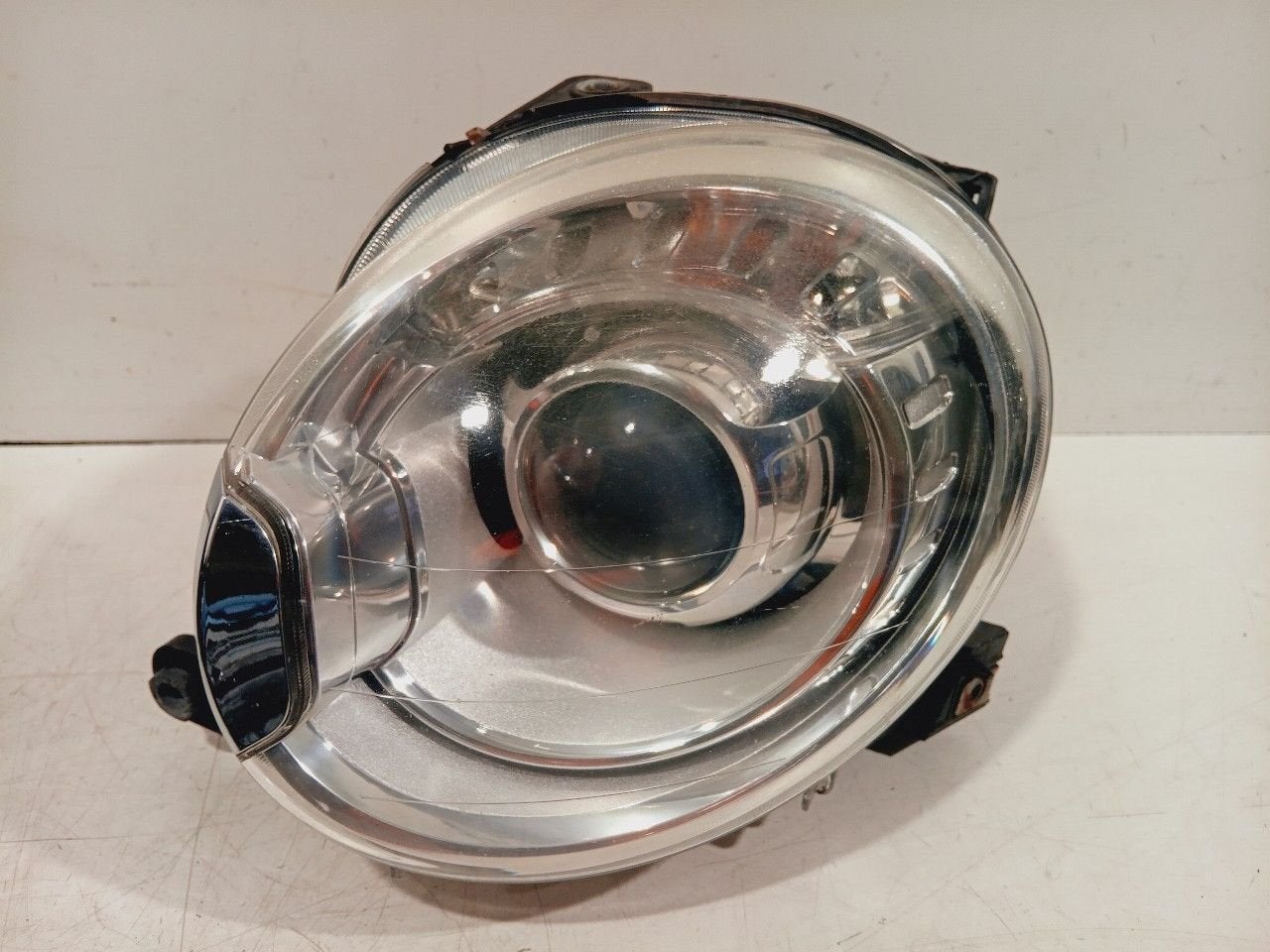 Koplamp links Fiat 500, Van der Ven Autorecycling B.V., Gebruikt, Ettenseweg 76, 4706 PB Roosendaal, The Netherlands, Herkomst onderdeel bekend