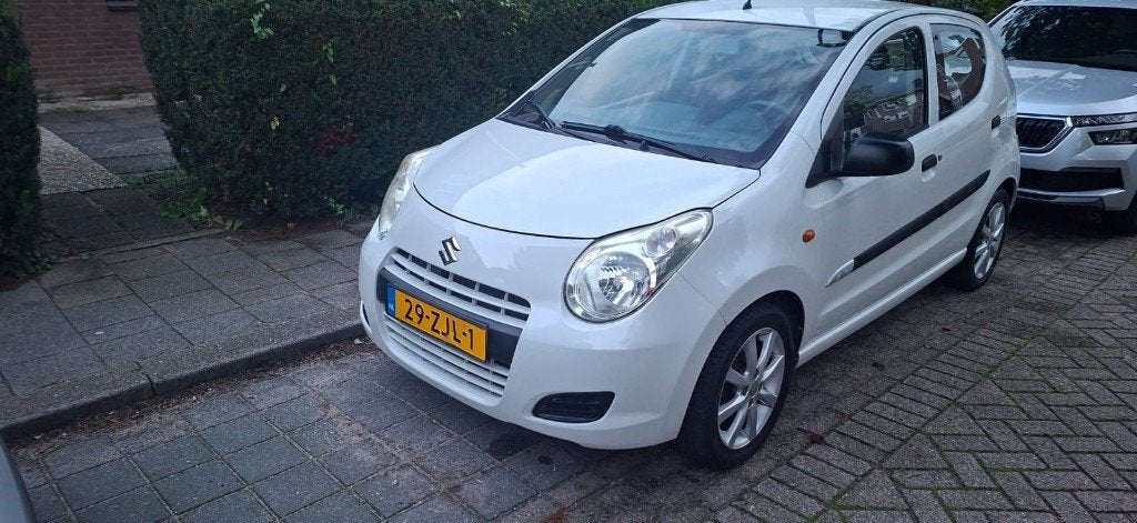 Suzuki Alto 1.0 2012 Wit, Voorwielaandrijving, Stof, 4 stoelen, Origineel Nederlands