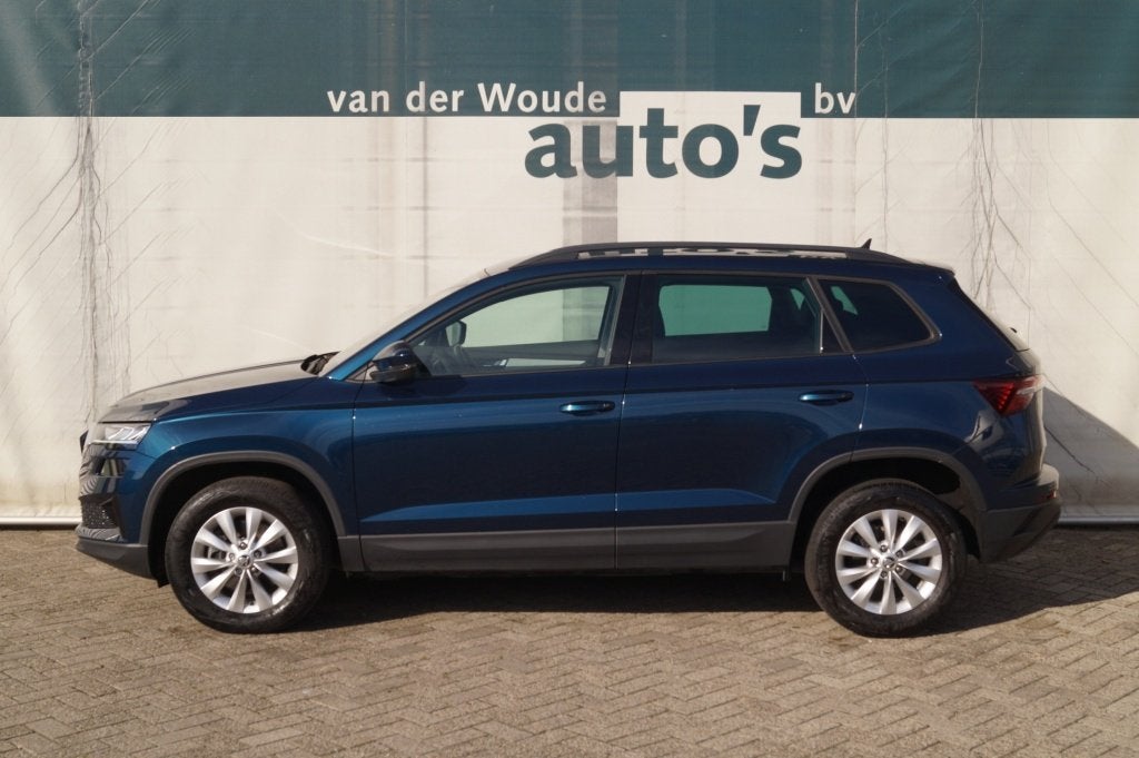 Skoda Karoq 2.0 TDI DSG Ambition -LEER-NAVI-ECC-PDC-, Auto's, Skoda, Automaat, Gebruikt, 4 cilinders, Blauw