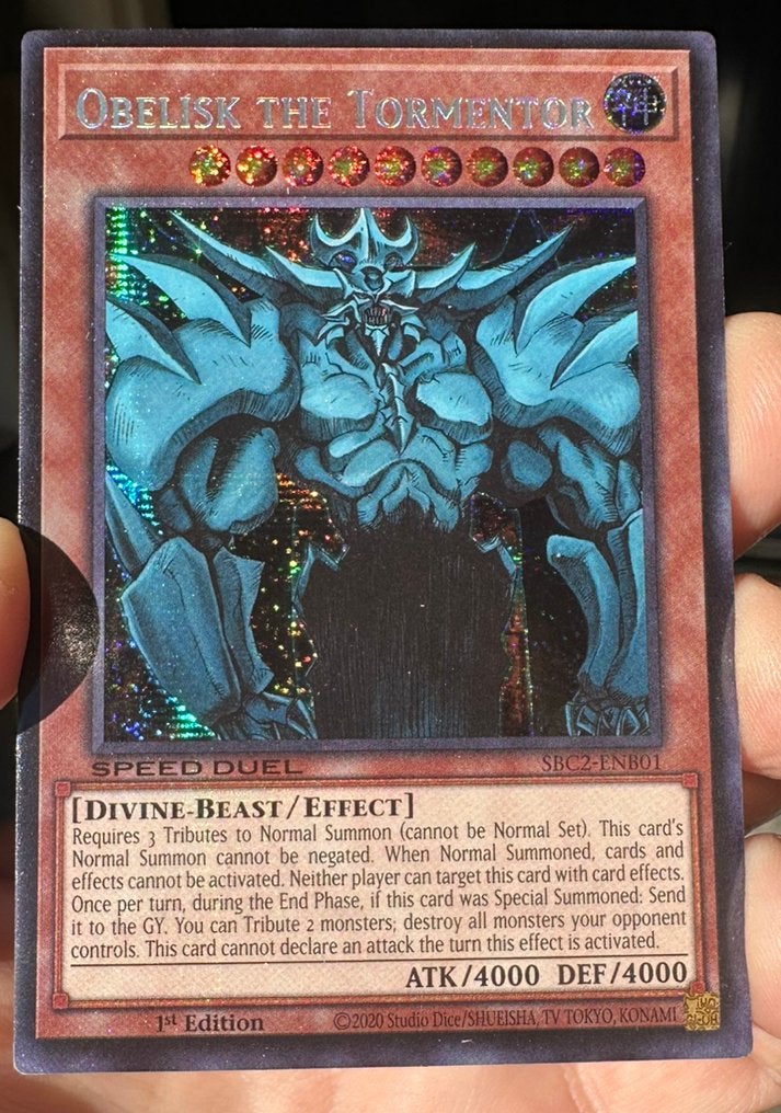 Yu-Gi-Oh! Obelisk the Tormentor SBC2 1st Duel Promo !, Ophalen of Verzenden, Zo goed als nieuw, Losse kaart, Foil
