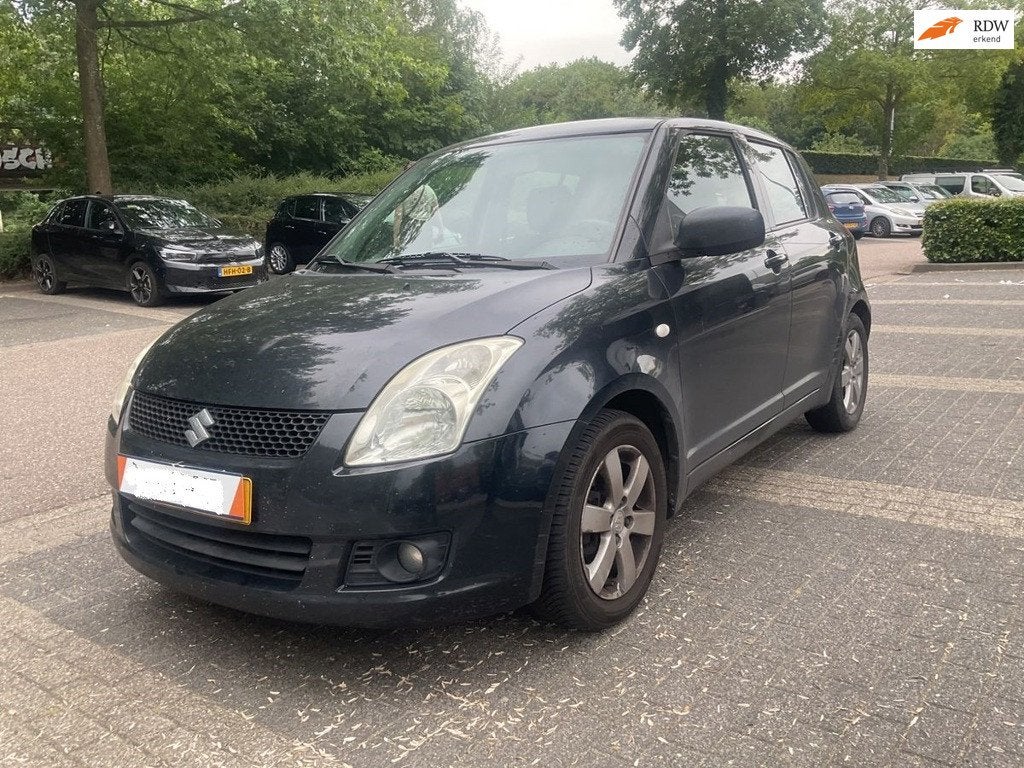 Suzuki Swift 1.3 Base 5 deurs zwart / Airco, Auto's, Voorwielaandrijving, Stof, Zwart, Bedrijf