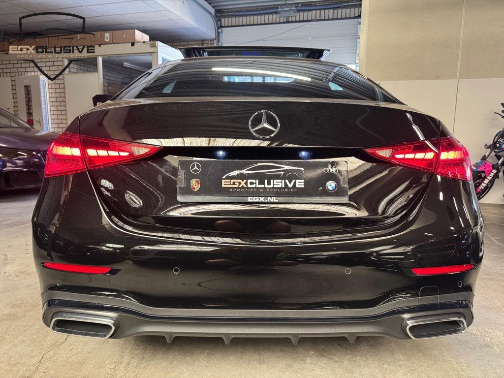 Mercedes-Benz C-klasse 180 AMG Line Pano/Ambiente/Camera, Auto's, Mercedes-Benz, Automaat, 4 cilinders, Zwart, Leder