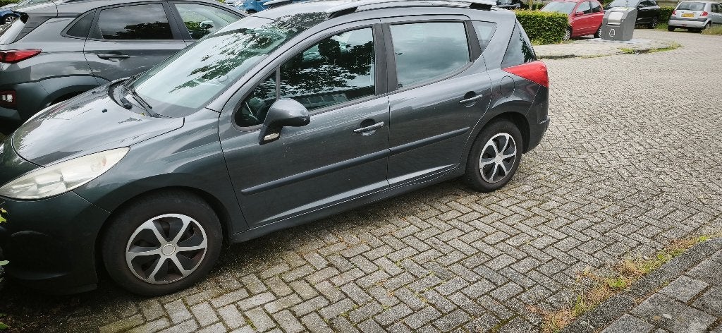 Peugeot 207 1.6 16V SW Outdoor 2008 Grijs Loopt niet goed!, Auto's, Voorwielaandrijving, Beige, 4 cilinders, Stationwagon