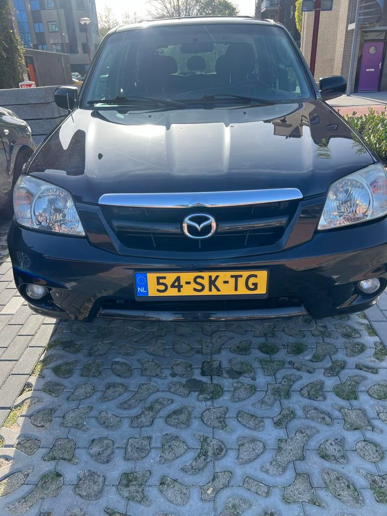 Mazda Tribute 2.3 Touring 4WD 2006 Zwart, Auto's, 680 kg, 4 cilinders, 75 €/maand, Handgeschakeld