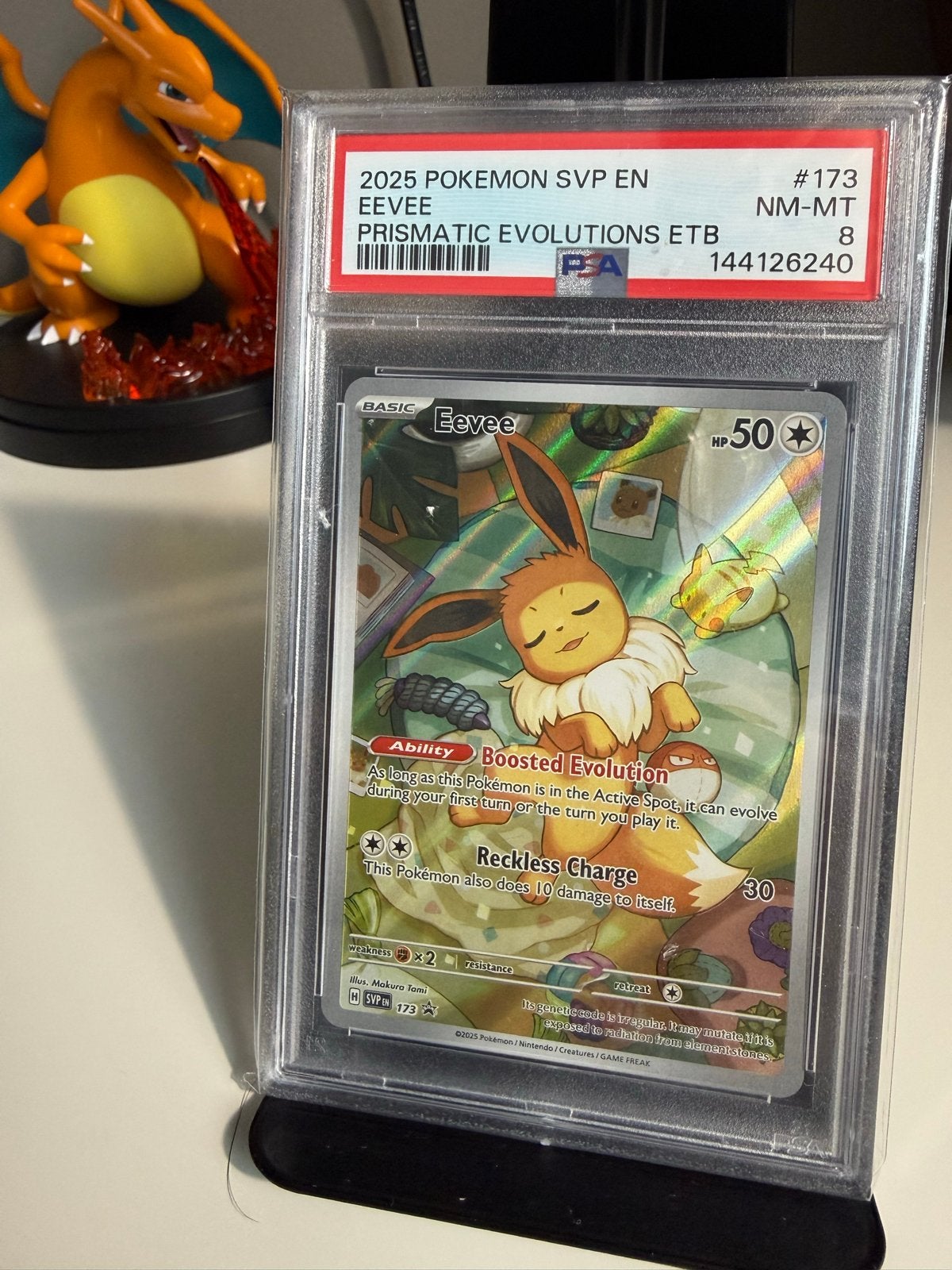 PSA 8 Eevee Prismatic Evolutions ETB Promo Pokémon Kaart, Ophalen of Verzenden, Zo goed als nieuw, Losse kaart