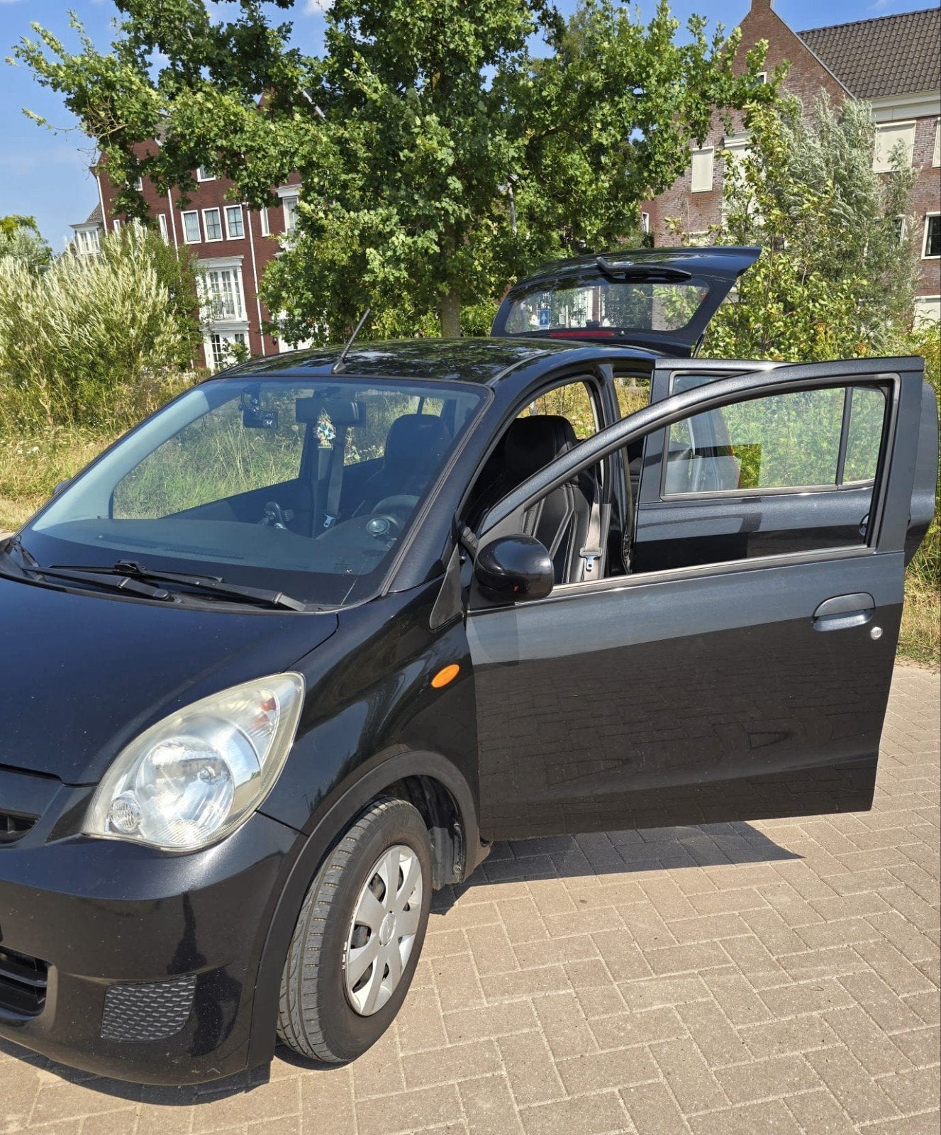 Daihatsu Cuore 1.0 5D AUT 2011 Zwart, Auto's, 600 kg, 18 €/maand, 4 stoelen, Cuore