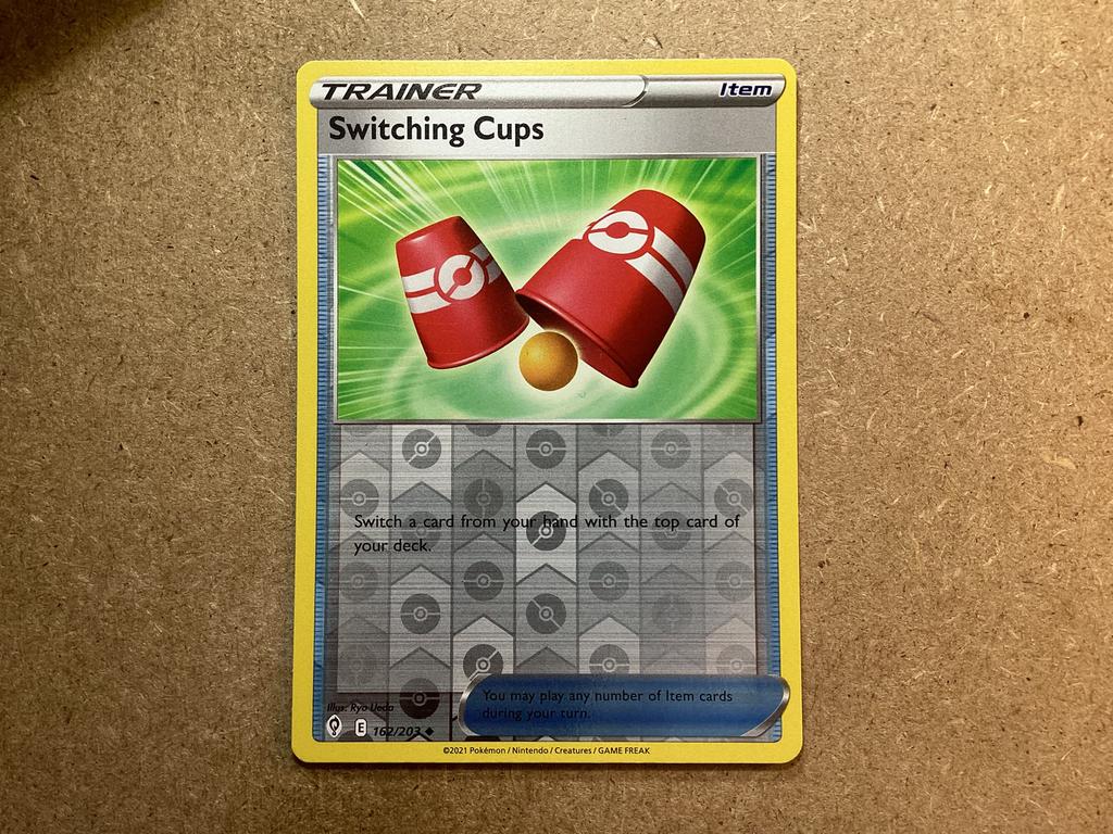 1x Switching Cups [EVS 162/203] (Excellent, Reverse Holo), Ophalen of Verzenden, Zo goed als nieuw, Losse kaart, Foil